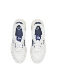 White sneakers with a navy side panel, perforated toe, and reflective accents. Features flat laces and a padded collar for comfort.