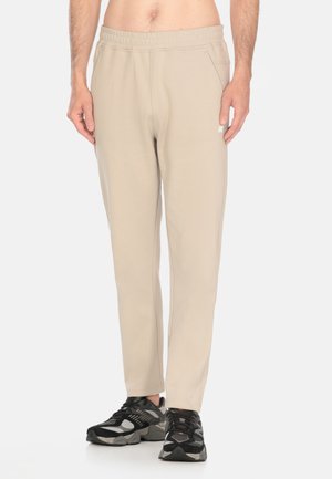 ITON INTERLOCK - Pantaloni sportivi - beige