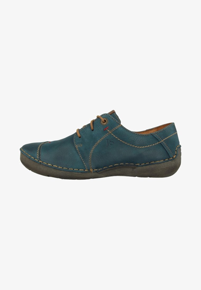 Scarpa di pelle teal con lacci marroni, cuciture a contrasto e punta arrotondata. Presenta una suola in gomma testurizzata per una migliore aderenza.