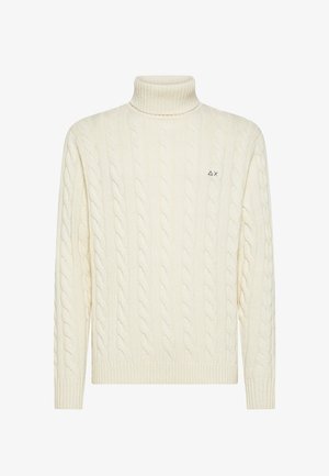 Maglione a collo alto a coste color crema con collo e bordo a coste. Presenta un piccolo logo sul lato sinistro del petto. Morbido al tatto e sagomato.