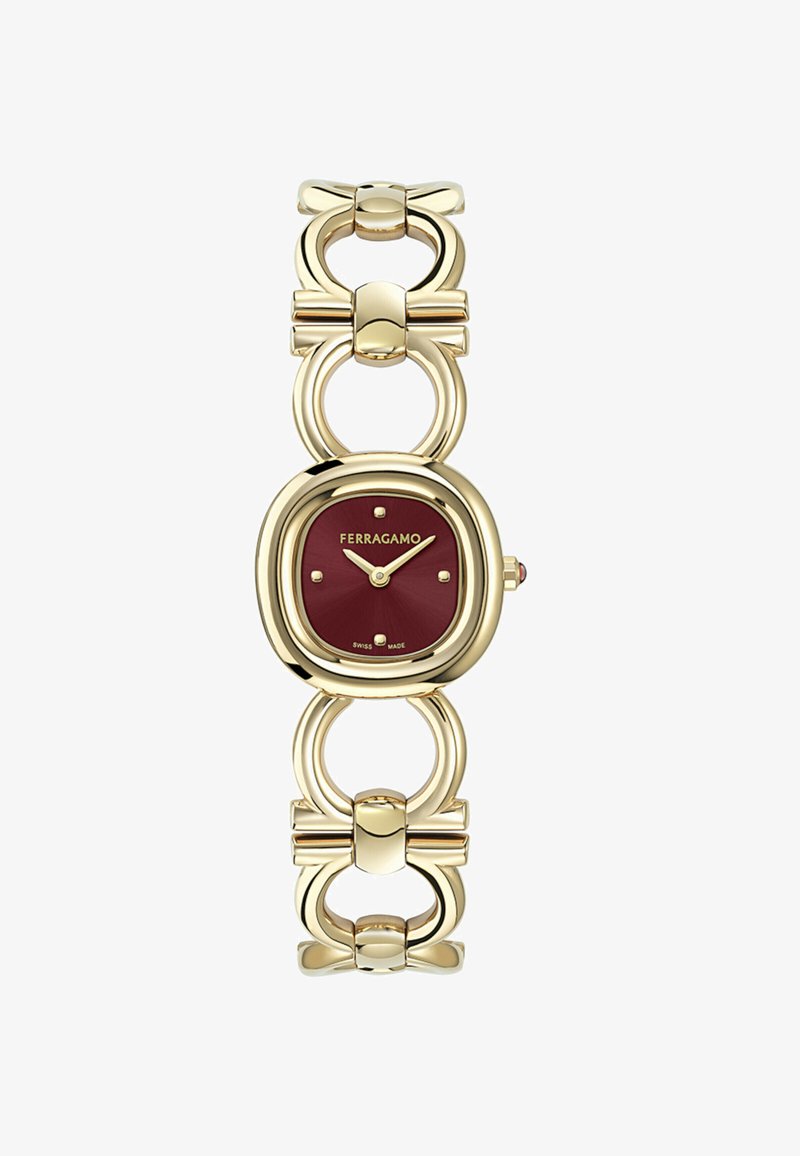 Goudkleurig Ferragamo-horloge met een rode vierkante wijzerplaat, minimalistische wijzers en een armband met strikvormige schakels.