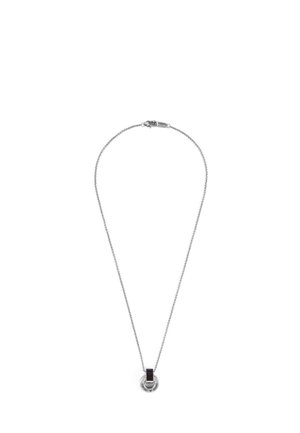 Silver chain necklace with a circular pendant featuring a vertical black rectangular inlay and engraved text around the edge.