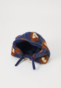 Blue fleece bucket hat with orange bear patterns, soft texture, adjustable tie, and a rounded design with a wide opening.