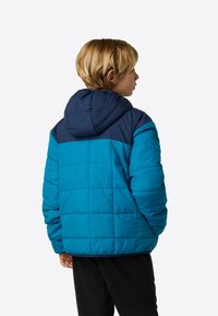 Μπλε και ναυτικό μπουφάν με κουκούλα, με κεντητό σχέδιο. Διαθέτει μονόχρωμο μπλοκ, μακριά μανίκια και άνετη εφαρμογή.