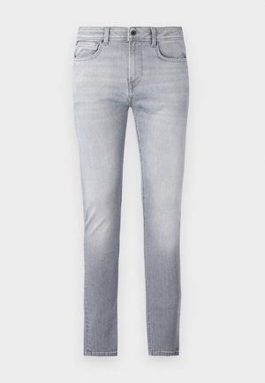 Lys grå denim jeans med rett passform, fem lommer, knapp- og glidelåsåpning, og lett falming ved lårene.