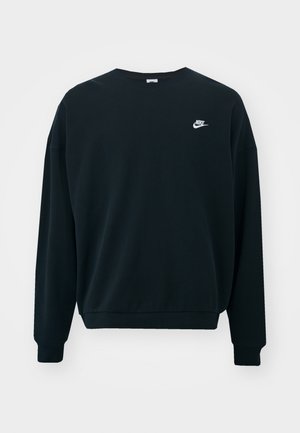 Čierna mikina Nike s dlhými rukávmi, okrúhlym výstrihom a rebrovanými manžetami. Má biele logo Nike na ľavej strane hrudníka.