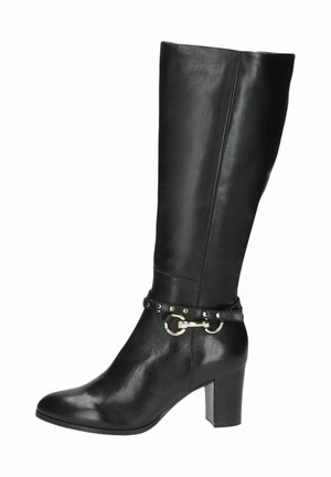 Black leather knee-high boot with a chunky heel, featuring a decorative strap with circular hardware and metal studs. Smooth texture throughout.