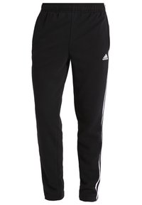 Czarne spodnie dresowe wykonane z miękkiego materiału, z tapered designem, elastycznym pasem i białymi paskami po bokach. Logo Adidas z lewej strony.