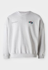 Gray cotton sweatshirt featuring a round neckline, ribbed cuffs, and a colorful "Vacation" graphic on the chest with printed text on the side.