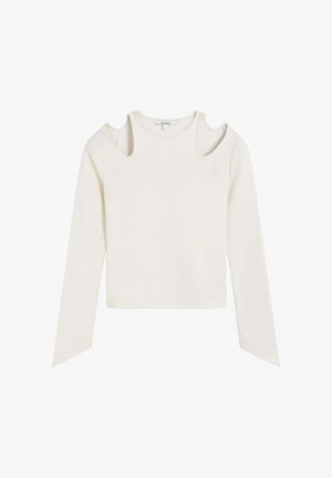 Long-sleeve, cream-colored top with shoulder cutouts, straight hem, and textured fabric. Simple design with no visible patterns or hardware.