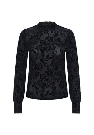 Blouse noire à manches longues avec motif floral en velours, col montant, tissu texturé et poignets resserrés.