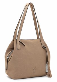 Beige perforated synthetic handbag with black trim, two shoulder straps, zipper closure, and a detachable tassel accent. Features a logo.