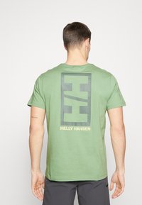 Helly Hansen CORE GRAPHIC - Camiseta estampada - jade