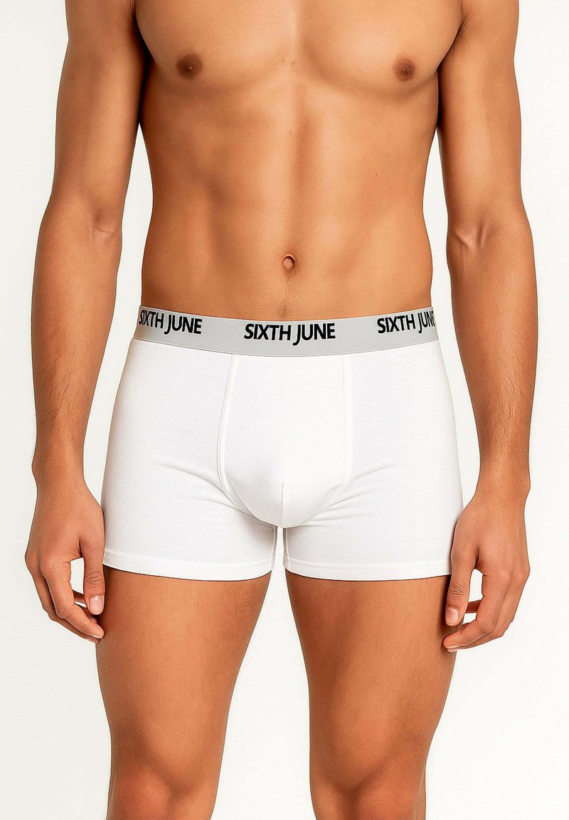 Male torso wearing white boxer briefs with gray waistband labeled "SIXTH JUNE" on a plain light background.