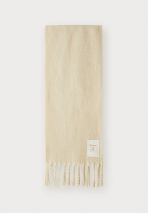 Sciarpa beige chiaro realizzata in morbido tessuto, con estremità frangiate e un piccolo etichetta del marchio nell'angolo in basso a destra.