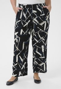 Black wide-leg trousers with abstract white and blue brushstroke patterns, elastic waistband, and side pockets. Soft fabric texture.