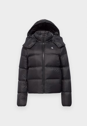 Black puffer jacket with a hood, featuring a zip closure, quilted design, and a logo on the chest. Soft, shiny material with long sleeves.