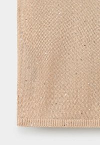 Tissu tricoté beige avec de petites paillettes dispersées et un bord côtelé en bas.