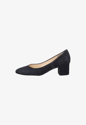 Pump midi in suede nero con punta affusolata e texture liscia, caratterizzata da un tacco largo e squadrato per maggiore stabilità. L'interno è beige.