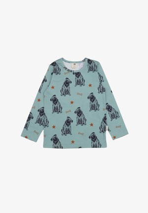 Long-sleeve t-shirt in teal fabric with dog and bone patterns, featuring dark dog illustrations and orange star accents. Round neckline.