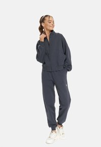 Cardio Bunny SLOW  - Tracksuit bottoms - grey