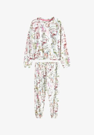Fleece pyjama set in het wit met kleurrijke konijnenpatronen. Top met lange mouwen en ronde hals, en broek met elastische tailleband en taps toelopende pijpen.