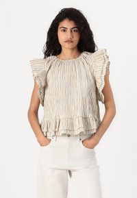 Haut sans manches en crème avec des rayures marron, doté de manches volantes et d'un ourlet évasé. Fabriqué en tissu texturé.