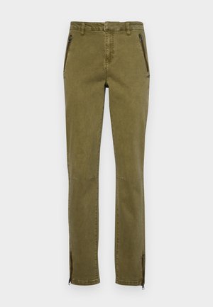 Pantaloni verde oliva in un tessuto resistente con una vestibilità slim. Presentano tasche con zip e due cerniere ai polsini per aperture regolabili.