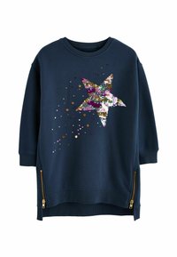 Mörkblå sweatshirt med en stor, flerfärgad paljett-stjärndesign och spridda paljetter. Har sidogylft vid fållen.
