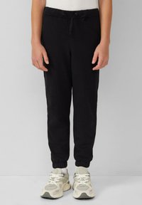 Zwarte tapered sweatpants van zachte stof, met een elastische tailleband en trekkoord, en met verlaagde enkels.
