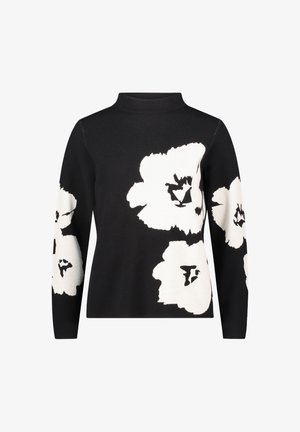 Czarny sweter z długim rękawem i wysokim kołnierzem, ozdobiony dużymi białymi wzorami kwiatowymi na przodzie i rękawach.