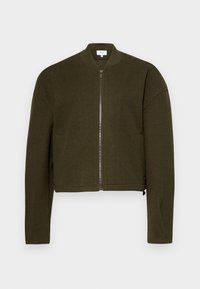 Olive green bomber jacket with a round collar, zipper front, and cropped design. Soft fabric and ribbed cuffs, featuring discrete side pockets.