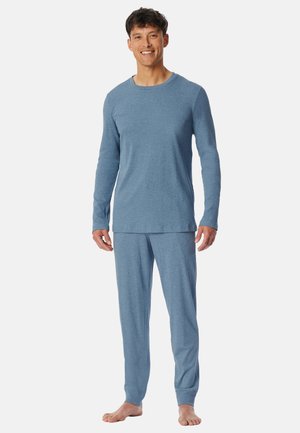 Haut de pyjama à manches longues bleu clair avec un col rond, associé à un pantalon assorti. Tissu doux avec une coupe décontractée et une taille élastique.