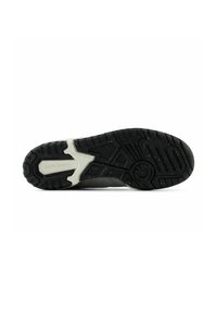 Black athletic shoe sole with textured rubber, featuring a lightweight design, white accents, and a patterned tread for grip.