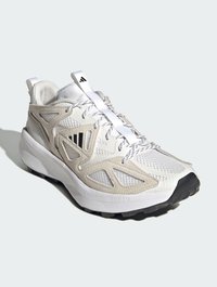 Lightweight men's sneaker in white and beige. Features mesh upper, contrasting textures, rubber sole, and lace-up design with logo on the tongue.
