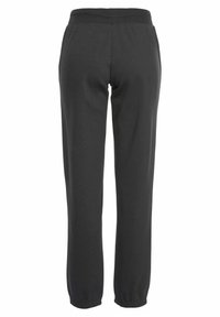 Donkergrijze joggingbroek met een elastische tailleband en elastische boorden bij de enkels, gemaakt van een zachte katoenmix.