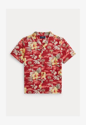 Cămașă roșie cu mâneci scurte, nasturi, decorată cu flori galbene de hibiscus, frunze verzi de palmier și mici flori albe, etichetă Polo Ralph Lauren.