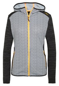 Gevoerde jas met zwart patroon aan de voorkant, effen zwarte mouwen en gele rits- en zakaccenten.