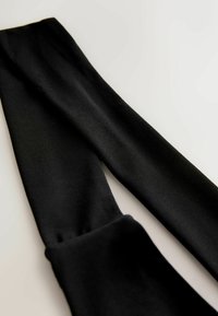 Schwarze Leggings aus glattem Stretchmaterial mit einer klassischen Passform. Dicke besitzt einen nahtlosen Bund und keine sichtbaren Muster oder Hardware.