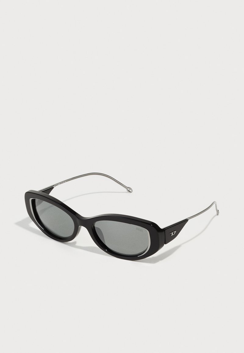 Black sunglasses with a sleek plastic frame, oval lenses, silver metal temples, and a distinctive logo on the side.