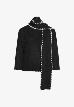 Sort strikket top med brede ærmer, der har en tekstureret overflade og en kontrasterende hvid dekorativ kant langs udskæringen og tørklædet.