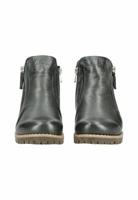 Bottines en cuir noir avec des zips sur les côtés, bouts ronds, semelles texturées et une semelle extérieure en caoutchouc naturel. Fini lisse et design épuré.