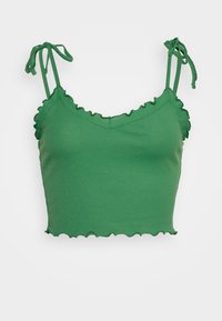 Grön följer crop top med volangkanter, utrustad med justerbara knytband och v-ringning. Slät textur och figurnära design.