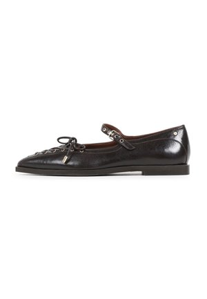 Black leather flat shoe with a pointed toe, lace-up detail, and a strap with hardware. Smooth texture and low heel design.