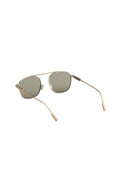 Gold metal frame sunglasses with green-tinted square lenses and adjustable nose pads, photographed on a white background.