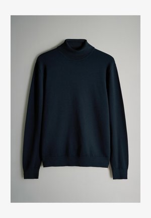 Suéter de cuello alto azul oscuro confeccionado en un material suave, con un cuello ajustado y mangas largas con puños y dobladillo acanalados.