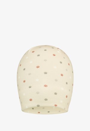 Strickmütze in Creme mit einem gepunkteten Muster aus kleinen Pfotenabdrücken in Pink, Grün und Grau. Weiche Textur und elastisches Design.