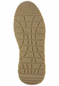 Semelle en caoutchouc beige avec des motifs de prise texturés, présentant une pointe arrondie et une forme striée pour une meilleure traction. Marquée avec la taille 37.