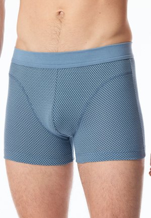 Blue boxer shorts made of stretchy fabric with a diamond pattern, featuring a solid waistband for secure fit.