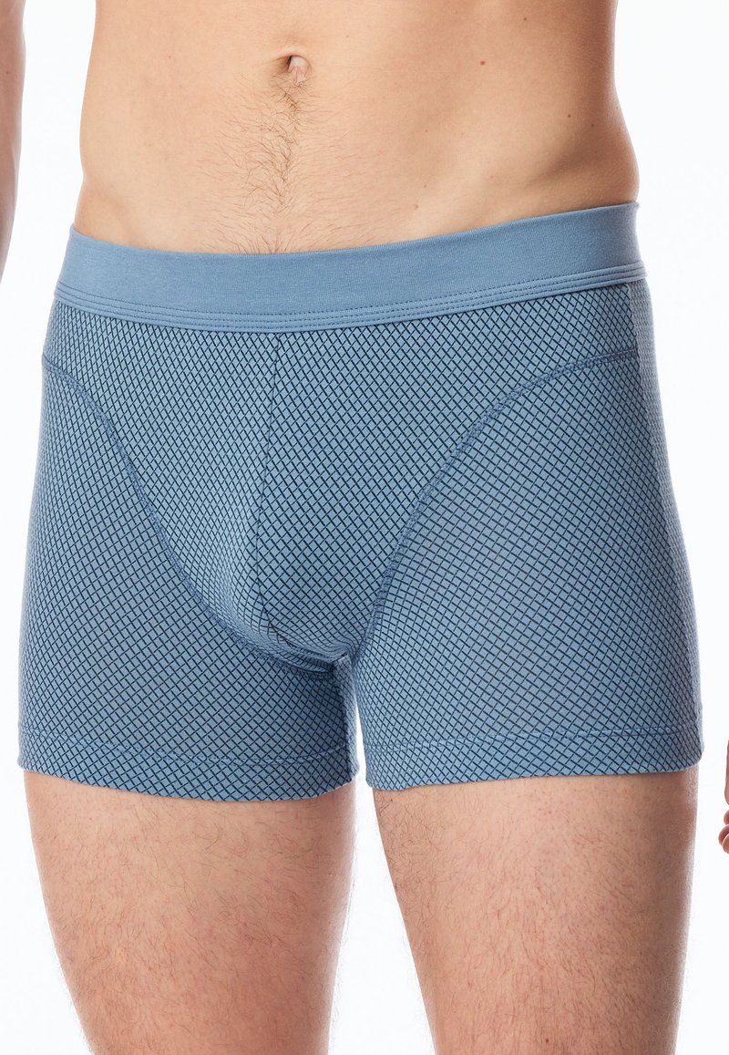 Blå kalsonger av stretchigt material med ett diamantmönster, med en solid midjeband för en säker passform.